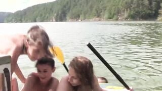 Group of naughty teens is having fun while swimming outdoor
