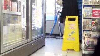 Japanese lady pissing in marketplace restroom