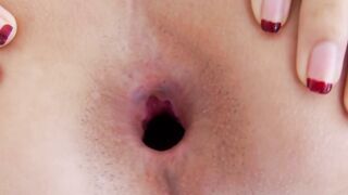 Asian ladyboy spreads her ass and strokes smooth cock solo
