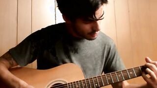 Handsome young man enjoys his guitar and jerkoff solo