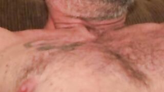 Mature and beefy gay shows off tattoo and masturbation