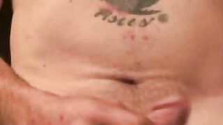 Mature and beefy gay shows off tattoo and masturbation
