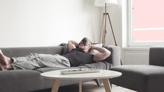 Hot blond ripped hunk loves tugging his dick on a couch