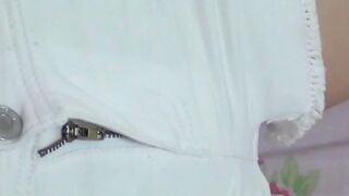 Young Japanese babe plays with her hairy vagina while filmed