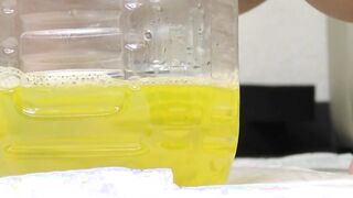 Japanese cutie removes her pants to fill the bottle with piss