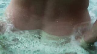 Buffed homosexual man jacks off big cock in the pool