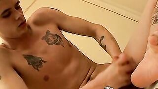 Tattoed twink worships his feet and cums after jacking off