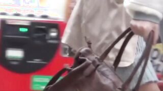 Classy Japanese babes taped under skirt by voyeur