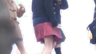 Four Japanese schoolgirls fool around outside before peeing