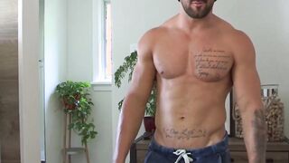 Buffed up guy strokes his hard cock and shows his hard abs