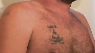 Hairy mature gay jerks off while smoking and shoots his load