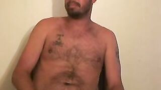 Hairy mature gay jerks off while smoking and shoots his load