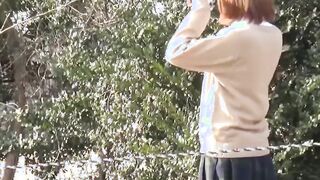 Kinky schoolgirls from Japan hold each other and pee outside