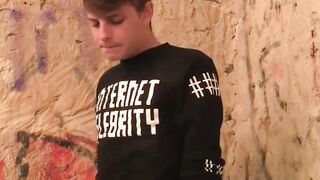 Blond twink fed with two dicks out in the open