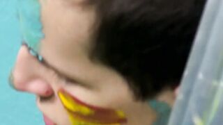 Colorful twink gets feet painted in blowjob induced cum