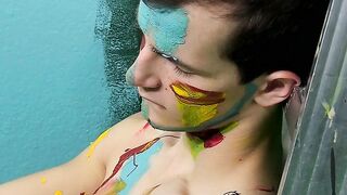 Colorful twink gets feet painted in blowjob induced cum