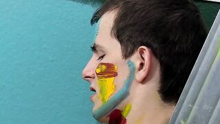 Colorful twink gets feet painted in blowjob induced cum