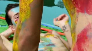 Colorful twink gets feet painted in blowjob induced cum