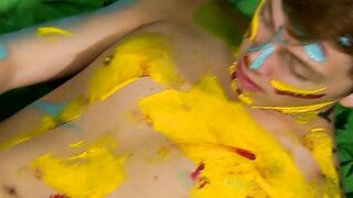 Colorful twink gets feet painted in blowjob induced cum