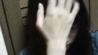 Adorable Japanese chick sits on the toilet and pees in a cup