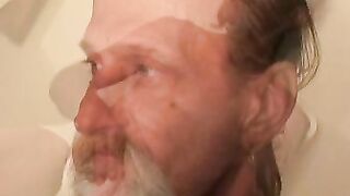 Bearded mature homo jerks off his big dick and comes hard
