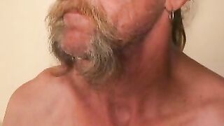 Bearded mature homo jerks off his big dick and comes hard