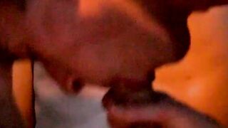 Naughty young man blowing his lover while inserting dildo