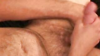 Older gay dude strokes his cock and covers himself with cum