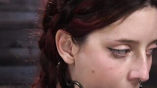 Redhead bound in a bridge position whipped