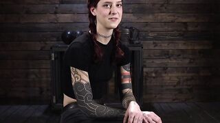 Redhead bound in a bridge position whipped