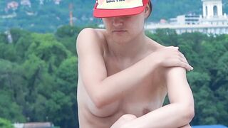 Adorable nudist teen enjoy sunbathing at the beach