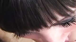 English chick with piercing smiles as she strokes a dick