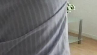 English chick with piercing smiles as she strokes a dick