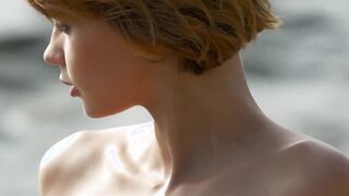 A sensual hipmoving redhead strips in front of others