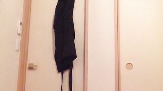 Naughty Japanese teen pees in a cup while putting makeup on