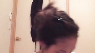 Naughty Japanese teen pees in a cup while putting makeup on
