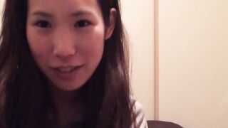 Naughty Japanese teen pees in a cup while putting makeup on