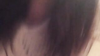 Naughty Japanese teen pees in a cup while putting makeup on