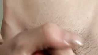 Skinny young gay strokes his hairy cock and cum blasts