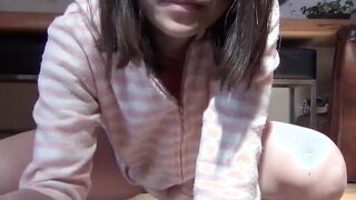 Japanese chick wakes up and pees in a jar while on the floor