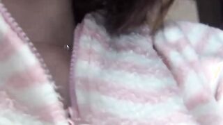 Japanese chick wakes up and pees in a jar while on the floor