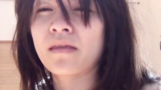 Japanese chick wakes up and pees in a jar while on the floor