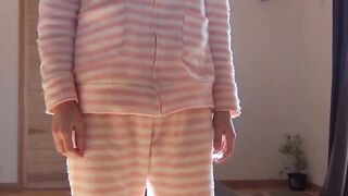 Japanese chick wakes up and pees in a jar while on the floor