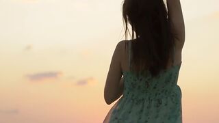 On the beach sexy beauty exposes her bare body