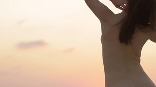On the beach sexy beauty exposes her bare body