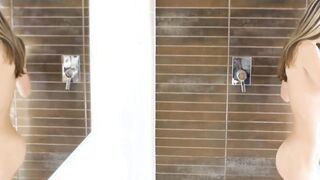 Gina Gerson a small woman amuses herself in the shower