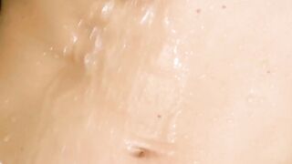 Gina Gerson a small woman amuses herself in the shower