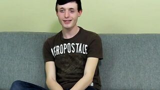 As he strokes his cock shorthaired twink plays with an asshole