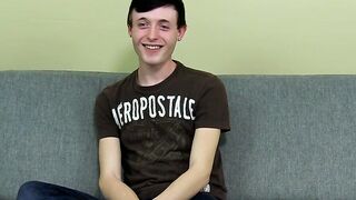 As he strokes his cock shorthaired twink plays with an asshole