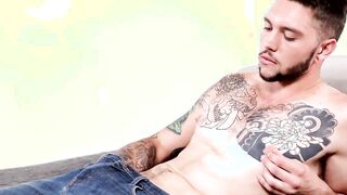 Young inked cutie working on his sweet cock really hard